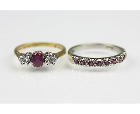 A ruby and diamond three stone ring hoop stamped '18ct PLAT W&H' and a 9ct white gold half eternity ruby set ring, total weig