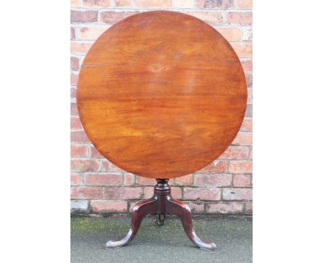 A George III mahogany tilt top occasional table, with turned column on tripod base, 72cm H x 86cm diam