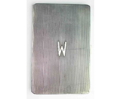 A silver cigarette case Alfred Dunhill, Paris, Adie Brothers, Birmingham 1932, engine turned decoration throughout with appli