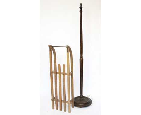 A Vintage wooden sledge baring retailers label for cambridge, 98cm long, and a stained standard lamp, 160cm high. It is recom