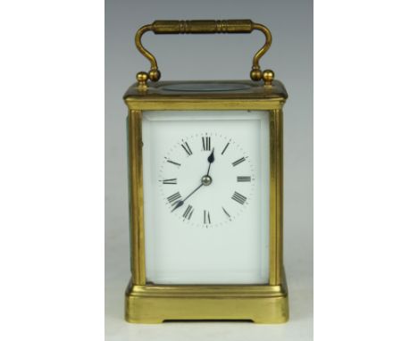 A laquered brass case carriage clock, early 20th century, the white enamel dial with black Roman numerals, 13cm high (over wo