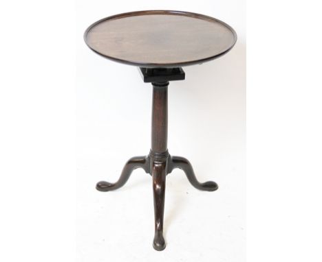 A George III mahogany circular tripod table, with dished top, on a bird cage and turned column with tripod base, 69cm H x 51c