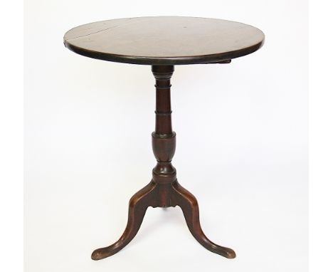 A George III mahogany tilt top tripod table, the solid top upon a vase turned column, on three pad foot cabriole legs 69cm H