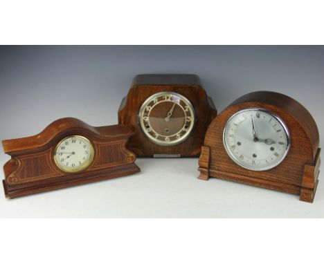 A selection of three mantle clocks, comprising an Art Deco mahogany mantle clock, an Edwardian mahogany and inlaid mantle clo