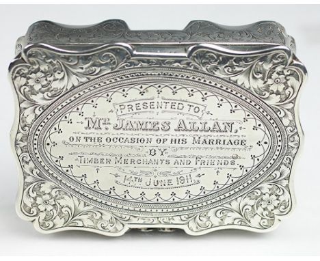 A silver table snuff box, Colen Hewer, Cheshire, Chester 1908, of shaped rectangular form and with all-over scrolling floral 