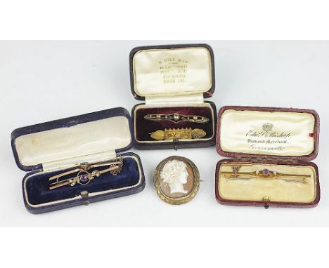 A collection of five assorted gold bar brooches, to include; stone set examples, two within original boxes and a cameo brooch