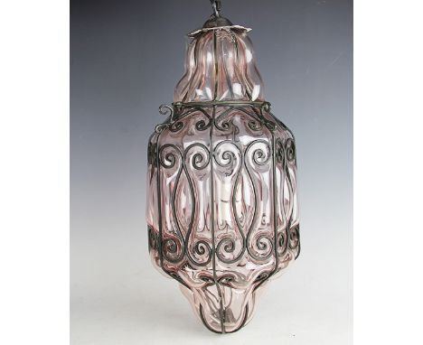 A French peach glass and wrought iron hall lantern, 50cm high, and a circular four light chandelier, 61cm wide. It is recomme