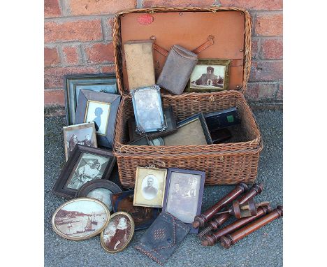 A collection of 19th century and later photograph frames, leather cigar case and other items, in a picnic hamper 