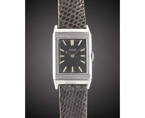 A RARE GENTLEMAN'S STAINLESS STEEL REVERSO STANDARD WRIST WATCHCIRCA 1930s, PRE JAEGER-LECOULTRE, WITH LUMINOUS BLACK DIAL & 