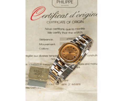 A RARE LADIES "NOS" STEEL & GOLD PATEK PHILIPPE NAUTILUS BRACELET WATCHCIRCA 1980s, REF. 4700/1 WITH GOLDEN SIGMA DIAL, UNWOR