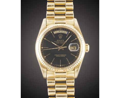 A GENTLEMAN'S 18K SOLID YELLOW GOLD ROLEX OYSTER PERPETUAL DAY DATE PRESIDENT BRACELET WATCHCIRCA 1978, REF. 18038 WITH BLACK