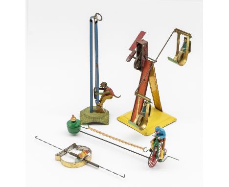 Tinplate: A collection of four early 20th century, lithographed tinplate penny toys to include: two people on a ferris wheel,