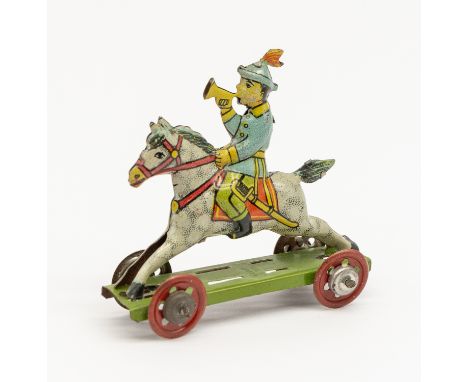 Meier: An early 20th century, lithographed tinplate penny toy young bugle boy on horseback. Made in Germany, by Meier. Marked