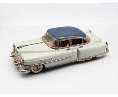 Gama: An unboxed Gama 300, tinplate, friction-driven two-tone blue Cadillac, in need of a clean, but visually in very good co