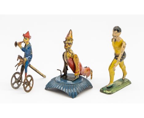 Tinplate: A collection of three early 20th century, lithographed tinplate penny toys, to include: a man in a running action, 