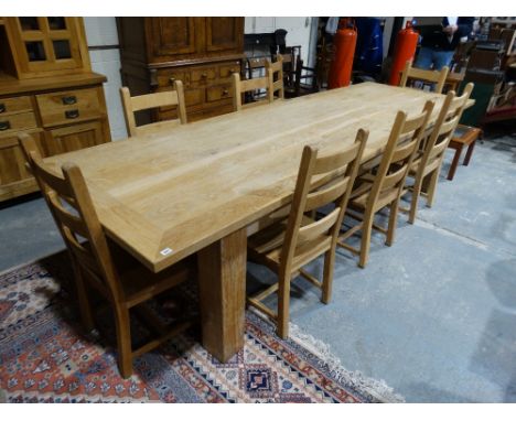 A 20th Century Oak Refectory Style Dining Table Of Planked Construction, Together With A Set Of Eight Ladder Backed Chairs, T