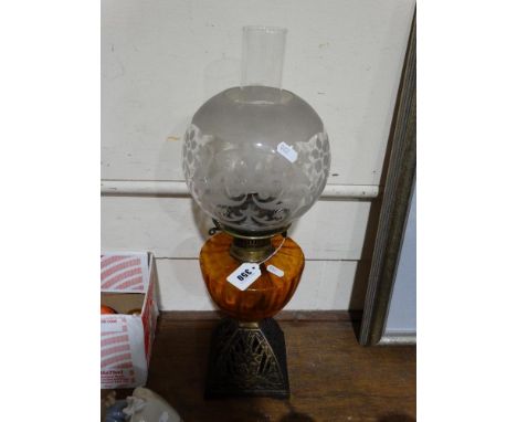     A Metallic Based Oil Lamp With Amber Tinted Reservoir                            