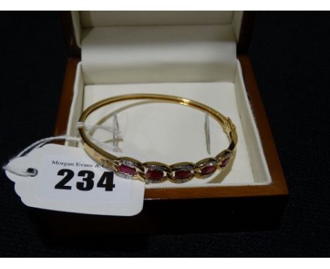     A 9ct Gold Red &amp; White Stone Set Bangle                                         