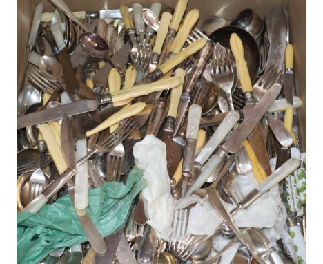 A large collection of plated cutlery, including a soup ladle, a cheese scoop, carving implements etc.