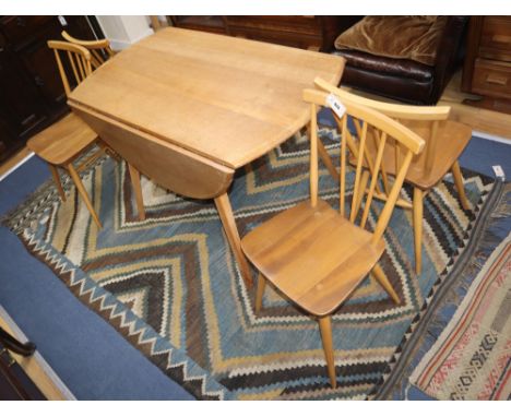 An Ercol drop leaf dining table and four chairs W.113cm