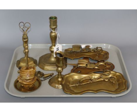 A group of 18th century Georgian brass lighting accessories including a candlestick, wax jack (associated parts), four pairs 