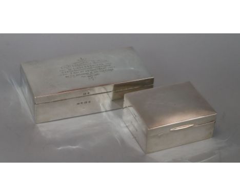 A late Victorian rectangular silver cigarette box with 1901 presentation inscription, Birmingham 1900, 19.5cm and a later eng