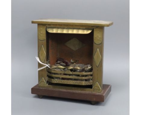 A World War I Trench art model of a fireplace with flint lighter