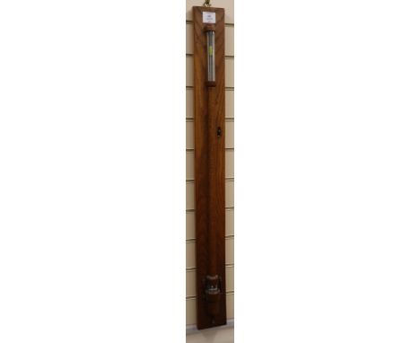 An oak stick barometer with ivory scales H.approx. 105cm