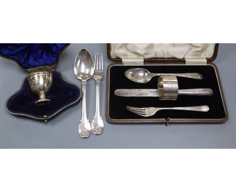 A George III silver spoon and fork christening set, by William Ely, London 1817, a cased knife, fork, spoon and napkin ring c