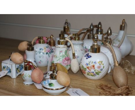 Sixteen ceramic perfume atomisers, mostly decorated with flowers