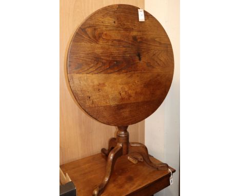 A George III oak circular tripod table W.75cm
