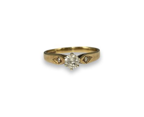 9ct Birmingham 1989 Yellow Gold Diamond Ring Comprising of a Round Cut Centre Stone weighing approximately 0.25cts and two sm