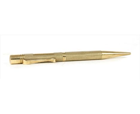 A 9 carat gold propelling pencil , with engine turned decoration