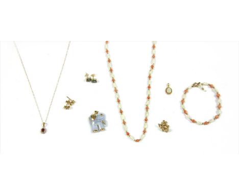 A gold banded agate elephant pendant, marked 585, together with a gold fracture filled ruby and diamond cluster pendant and c