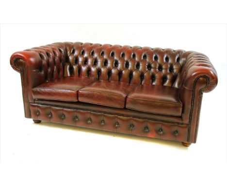 A red leather Chesterfield three seater sofa, 190cm wide, 93cm deep, 75cm high