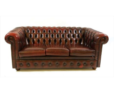 A red leather Chesterfield three seater sofa, 190cm wide, 93cm deep, 75cm high