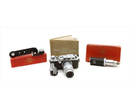 A Leica III DRP camera, c. 1936, serial number 226304, 14cm wide, with an Elmar lens and various accessories