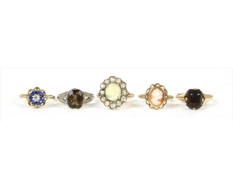 Five gold rings, to include a single stone bloodstone ring, marked 9ct, finger size M ½, an opal and paste cluster ring, test