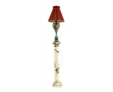 An onyx table lamp on pedesta l, 20th century