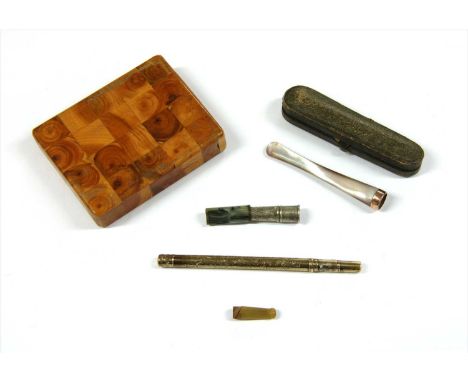 A cased 9ct gold mother-of-pearl cheroot holder, Chester 1919, together with another cheroot holder, a wooden cigarette case,