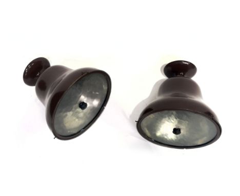 A large pair of Industrial style pendant light fittings, circa 1930s, brown painted bell form with glass discs, 30cm high (2)