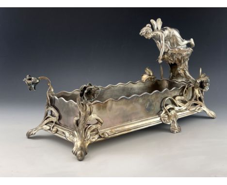 WMF, a large Jugendstil silver plated figural centrepiece, the rectangular section planter on four foliate and floral bracket