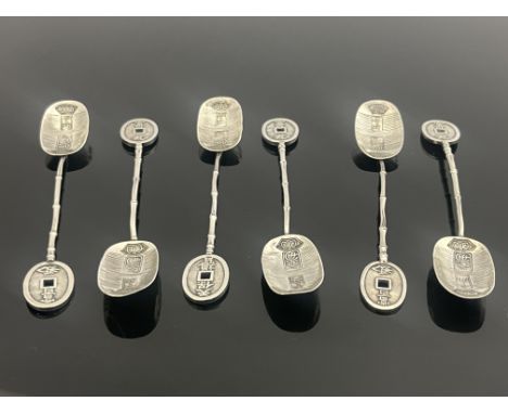 A set of six Chinese silver teaspoons, script marks to the bowls, simulated bamboo handles, pierced oval finials, import mark