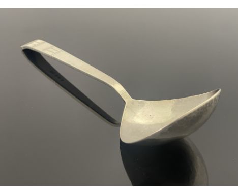 Bernard Cuzner, a large Arts and Crafts silver spoon, London 1943, planished ladle form bowl, incised banding to the finial, 