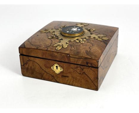 A Victorian figured walnut and Ashford Marble games box, retailed by Wedgwood &amp; Sons, 9 Cornhill, plaque depicting a flor