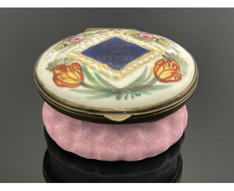 A Bilston enamelled patch box, circa 1780, oval, painted with a blue diamond plaque inscribed Love the Giver, within floral g