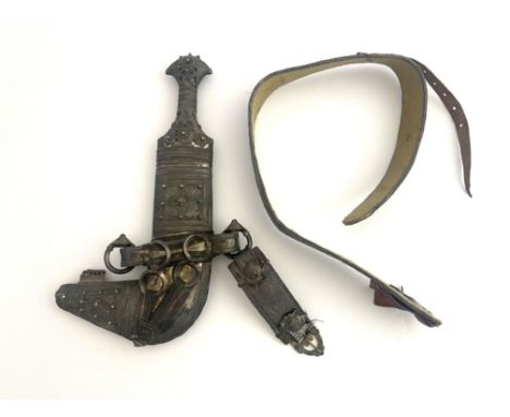 A late 19th century / early 20th century Omani jambiya, double edged blade with raised medial ridge, white metal hilt with em