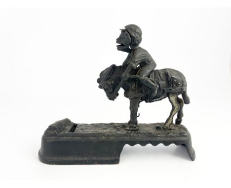 An American 'I always did 'spise a mule' cast iron mechanical money bank, J. &amp; E. Stevens Co, circa 1880, modelled as a j