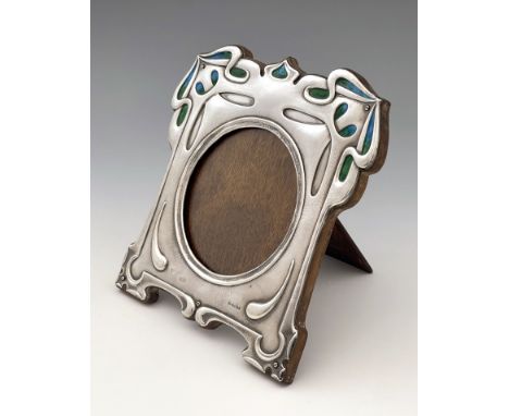 Kate Harris for William Hutton, an Arts and Crafts large silver and enamelled photo frame, London 1902, planished and embosse