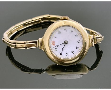 A 9 carat gold ladies wristwatch, on plated link strap, 3cm diameter